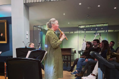 Katherine Spencer demonstrating a chalumeaux to students at the Royal College of Music